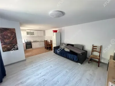 Casa individuala de inchiriat cu 3 camere 3 bucatarii pivnita situata in localitatea Poplaca din Sibiu - foto 2