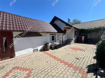 Casa individuala de inchiriat cu 3 camere 3 bucatarii pivnita situata in localitatea Poplaca din Sibiu - foto 11