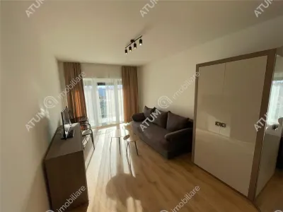 De vanzare garsoniera la etajul 1 cu balcon si loc de parcare in cartierul Da Vinci din zona de Vest Sibiu - foto 2
